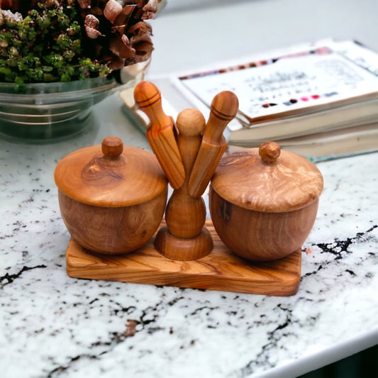 Salt and pepper holder with spoons